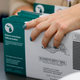 Workers start pre-processing absentee ballots at the city of Lansing Clerk’s Election Unit on November 2, 2020 in Lansing, Michigan